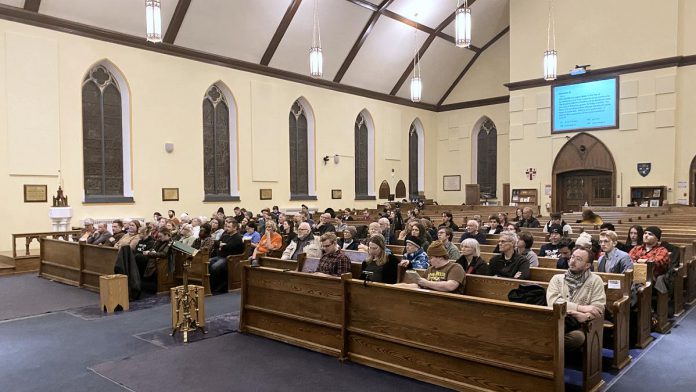 Around 90 people attended an all-candidates provincial election debate on homelessness and housing at All Saints' Anglican Church in Peterborough on February 12, 2025, with around 200 people watching the livestream of the debate. Peterborough-Kawartha MPP Dave Smith was the only candidate who did not participate in the debate. (Photo: Paul Rellinger / kawarthaNOW)