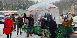 Youth of the 1st Bancroft Scouting Group at the 2024 Bancroft Santa Claus Parade where they donned homemade mini-canoes as a part of their floats. They will be using those canoes again as the Winter Carnaval event they are hosting at Big Rock Eco Retreat in Addington Highlands on March 22, 2025. A part of the Scouts Canada National Challenge, the family-friendly afternoon will include outdoor games, demonstration, tasty treats, music, and more. (Photo courtesy of 1st Bancroft Scouting Group)