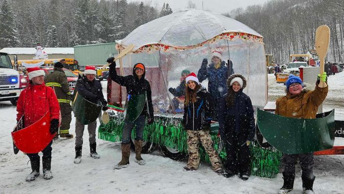 Youth of the 1st Bancroft Scouting Group at the 2024 Bancroft Santa Claus Parade where they donned homemade mini-canoes as a part of their floats. They will be using those canoes again as the Winter Carnaval event they are hosting at Big Rock Eco Retreat in Addington Highlands on March 22, 2025. A part of the Scouts Canada National Challenge, the family-friendly afternoon will include outdoor games, demonstration, tasty treats, music, and more. (Photo courtesy of 1st Bancroft Scouting Group)