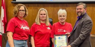 Municipality of Brighton Applefest committee members joined members of Brighton council, including Mayor Brian Ostrander (right) during a Municipality of Brighton council meeting on March 3, 2025 to celebrate Brighton's Applefest being recognized as one of the "Top 100" festivals for 2025 from Festival & Events Ontario. (Photo: Municipality of Brighton)