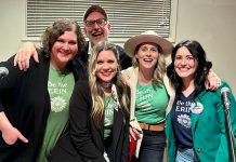 Musicians Kate Brioux, Paul Crough, Kate Suhr, Melissa Payne, and emcee Megan Murphy sport matching shirts reading "Be the Erin," as in "Be the Erin you want to see in the world," at a kitchen party fundraiser in honour of the late Erin Sullivan in March 2024. The second annual event, from which all proceeds go towards the mortgage of a home in Sullivan's name that houses people coming out of homelessness, will be held on March 14, 2025, at the Ennismore Community Centre. (Photo courtesy of Jessica Carroll)