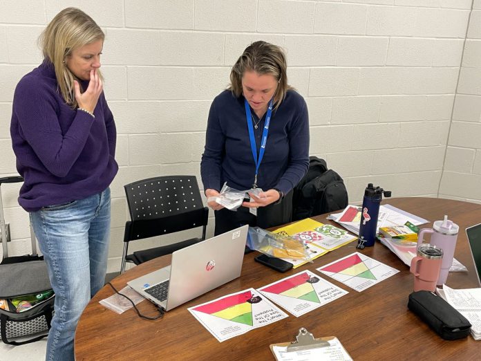 In between classes, Five Counties clinicians Katy Morton (left) and Emily Vann prepare for their next lesson. In a single day at St. Joseph's Catholic Elementary School in Douro, the duo supported Grade 1 and 2 students to form letters, visited a senior kindergarten and Grade 1 class to support the teacher in offering activities for students' fine motor skills, and worked with Grade 4 students on self-regulation. Their work is a sampler of what Five Counties staff do in schools across Peterborough, Kawartha Lakes, Northumberland, and Haliburton. (Photo courtesy of Five Counties)