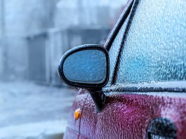 A car covered in ice from freezing rain. (Stock photo)