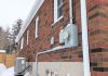 Madeleine Pengelley and David Pritchard's home in Peterborough's East City is fully powered by electricity and no longer has a connection to a gas line. The transition from gas has taken all fossil fuel combustion, and therefore all risk of carbon monoxide, out of their home. This photo shows their electricity meter and heat pump operating on a cold February morning. (Photo: Clara Blakelock / GreenUP)