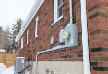 Madeleine Pengelley and David Pritchard's home in Peterborough's East City is fully powered by electricity and no longer has a connection to a gas line. The transition from gas has taken all fossil fuel combustion, and therefore all risk of carbon monoxide, out of their home. This photo shows their electricity meter and heat pump operating on a cold February morning. (Photo: Clara Blakelock / GreenUP)