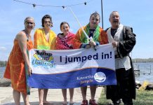 Kawartha Lakes real estate sales representives Dean Michel (right) and Jennifer Bacon (left) and their family after plunging into Balsam Lake for the Jump in the Lake Challenge on May 4, 2024. The 6th annual challenge, which encourages Coboconk-area residents to take to take a cold plunge into their local lake for a good cause, is being held on May 3, 2025 with the goal of raising $20,000 towards the Coboconk & Area Food Bank. (Photo courtesy of Dean Michel)