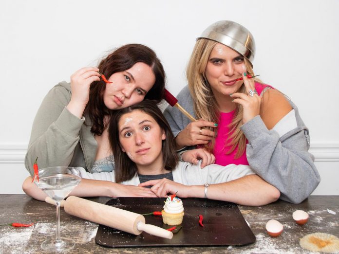 Toronto-based sketch comedy trio The Red Hot Sili Peppers (Glenna Walters, Emily Callahan, and Julia Ettlinger) will be joining host Linda Kash and local improv artists Jennine Profeta, Janet Van De Graaff, and Megan Murphy for klusterfork entertainment's "Impros All-Pros" comedy show at the Gordon Best Theatre in downtown Peterborough on March 21, 2025. (Photo: Alicia Carrick)