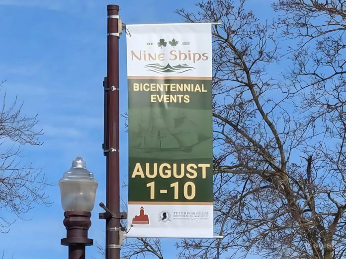 One of the 15 new banners hanging from lamp posts on George Street in downtown Peterborough to promote Peter Robinson emigration bicentennial events from August 1 to 10, 2025. The banners were installed by non-profit organization Nine Ships 1825 Inc. in partnership with the Peterborough Historical Society and with funding from the Peterborough Foundation. (Photo courtesy of Nine Ships 1825)