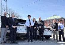 Chief Stuart Betts (third from left) marked the beginning of the celebrations of the Peterborough Police Service's 175th anniversary on March 18, 2025 by placing the police service's official 175th anniversary on marked patrol vehicles. Also pictured from left to right are police services board vice-chair Drew Merrett, Peterborough mayor and board member Jeff Leal, board chair Mary ten Doeschate, city councillor and board member Gary Baldwin, board member Steve Girardi, and deputy chief Jamie Hartnett. (Photo courtesy of Peterborough Police Service)