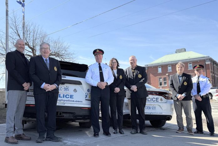 Chief Stuart Betts (third from left) marked the beginning of the celebrations of the Peterborough Police Service's 175th anniversary on March 18, 2025 by placing the police service's official 175th anniversary on marked patrol vehicles. Also pictured from left to right are police services board vice-chair Drew Merrett, Peterborough mayor and board member Jeff Leal, board chair Mary ten Doeschate, city councillor and board member Gary Baldwin, board member Steve Girardi, and deputy chief Jamie Hartnett. (Photo courtesy of Peterborough Police Service)