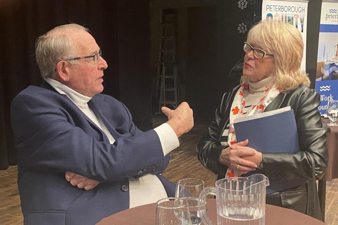 Armstrong Trade and Logistics Advisory Services president Bob Armstrong speaks with Peterborough County warden Bonnie Clark following a panel discussion at the Market Hall in downtown Peterborough on March 4, 2025. (Photo: Paul Rellinger / kawarthaNOW)