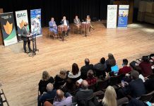 Four experts in the areas of trade, finance, and supply chain management discussed strategies to help local businesses navigate the challenges posed by shifting trade policies and U.S. tariffs at a panel discussion at the Market Hall in downtown Peterborough on March 4, 2025. Pictured are Andrew Pyle, Armstrong Trade and Logistics Advisory Services president Bob Armstrong, Trent University economics professor Dr. Saud Choudry, and Peterboro Matboards CFO and Kawartha Manufacturers Association secretary Sherry Hill as Joel Wiebe, vice president of government relations and operations for Peterborough and the Kawarthas Chamber of Commerce, looks on. (Photo: Community Futures Peterborough)