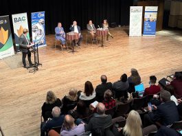 Four experts in the areas of trade, finance, and supply chain management discussed strategies to help local businesses navigate the challenges posed by shifting trade policies and U.S. tariffs at a panel discussion at the Market Hall in downtown Peterborough on March 4, 2025. Pictured are Andrew Pyle, Armstrong Trade and Logistics Advisory Services president Bob Armstrong, Trent University economics professor Dr. Saud Choudry, and Peterboro Matboards CFO and Kawartha Manufacturers Association secretary Sherry Hill as Joel Wiebe, vice president of government relations and operations for Peterborough and the Kawarthas Chamber of Commerce, looks on. (Photo: Community Futures Peterborough)