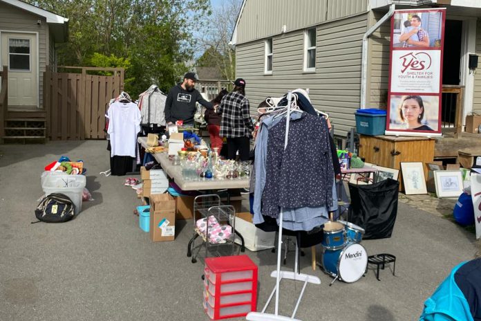 Some participants in the East City Neighbourhood Yard Sale use the opportunity to support community organizations. In 2024, Leigh Ramsay raised about $800 for YES Shelter for Youth and Families. (Photo: Leigh Ramsay)