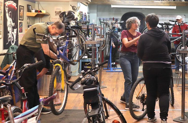 Bike mechanic and outreach manager Jean Greig conducts a workshop for Shifting Gears participants about the A, B, and Cs of bike maintenance at B!KE: The Peterborough Community Bike Shop in downtown Peterborough. The annual Shifting Gears May Challenge administered by GreenUP invites Peterborough residents to shift the way they move for the month of May, whether by walking, cycling, taking public transit, or carpooling. (Photo: Lili Paradi)