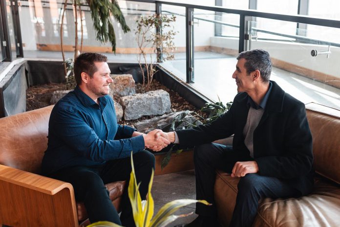 Andrew Nokes, founder of Creativity by Code and ReziLink, shakes hands with Eduard Yonathan, founder of SanoStrategy. Both tech entrepreneurs are clients of the Innovation Cluster, which serves early-stage small and medium-sized businesses in the cleantech, agritech, health and medical tech, nuclear, and digital tech sectors. (Photo: Bryan Reid for Innovation Cluster Andrew Nokes, founder of Creativity by Code and ReziLink, shakes hands with Eduard Yonathan, founder of SanoStrategy. Both tech entrepreneurs are clients of the Innovation Cluster, which serves early-stage small and medium-sized businesses in the cleantech, agritech, health and medical tech, nuclear, and digital tech sectors. (Photo: Bryan Reid for Innovation Cluster