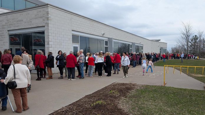 There was a long lineup outside the Peterborough Sport & Wellness Centre on April 19, 2025 for a rally featuring federal Liberal leader and prime minister Mark Carney. (Photo: Bruce Head / kawarthaNOW)