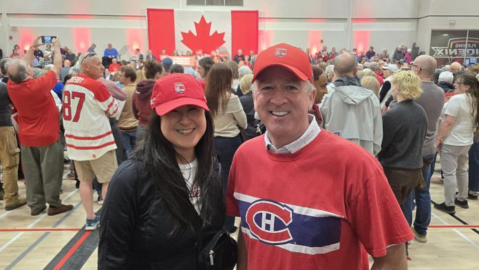 Sacha Lai-Svirk and Paul Hickey of Peterborough advertising agency Outpost379 at a rally featuring federal Liberal leader and prime minister Mark Carney the Peterborough Sport & Wellness Centre on April 19, 2025. (Photo: Jeannine Taylor / kawarthaNOW)