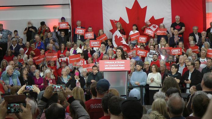 Peterborough federal Liberal candidate Emma Harrison introduced federal Liberal leader and prime minister Mark Carney at a rally at the Peterborough Sport & Wellness Centre on April 19, 2025. Other Liberal candidates in the Kawartha region were also at the rally. (Photo: Bruce Head / kawarthaNOW)