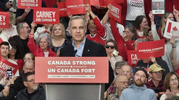 Federal Liberal leader and prime minister Mark Carney mentioned some well-known Peterborough hockey icons including Bob Gainey and Roger Neilson during a rally at the Peterborough Sport & Wellness Centre on April 19, 2025. (Photo: Jeannine Taylor / kawarthaNOW)