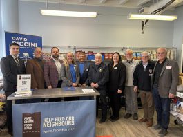 Cobourg mayor Lucas Cleveland (left) and Northumberland-Peterborough South MPP David Piccini (second from left) were at the Northumberland Fare Share Food Bank in Cobourg on April 22, 2025 to celebrate a $149,600 Resilient Communities Fund grant from the Ontario Trillium Foundation that the food bank is using to fund a full-time volunteer coordinator and implement a new online volunteer management system. (Photo: Office of David Piccini / Facebook)