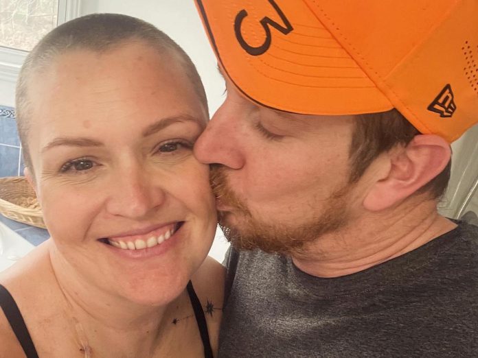 Diana Freeman receiving love and support from her husband David while undergoing chemotherapy at Peterborough Regional Health Centre (PRHC). At 38 years old, the mother and local business owner was diagnosed with breast cancer in March 2024. Receiving her cancer treatment close to home in Peterborough meant she did not have to change her daily routine of dropping her daughters off at the bus stop in the mornings and allowed her to rely on her neighbours and nearby support system. (Photo courtesy of Diana Freeman)