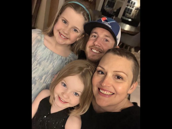 Diana Freeman with her husband David and their daughters Olivia and Emily. In December 2024, nine months after she discovered a lump in her left breast, Freeman was declared cancer-free following a double mastectomy and then months of chemotherapy and radiation at Peterborough Regional Health Centre (PRHC). Although the physical toll of her treatment was significant, as with many cancer patients, it was the delay between the initial cancer diagnosis and the prognosis that created the most anxiety for Freeman. That's why she is  supporting the PRHC Foundation's $60 million Campaign for PRHC and sharing her story to help bring digital pathology to the hospital. (Photo courtesy of Diana Freeman)