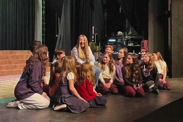 Macayla Vaughan as the Narrator with the children's chorus during a media rehearsal for "Joseph and the Amazing Technicolor Dreamcoat" at the Peterborough Theatre Guild, which is bringing the famous musical to the stage at Showplace Performance Centre in downtown Peterborough for eight performances from April 25 to May 4, 2025. Director Robert Ainsworth has written an introduction to the play, which is based on the character of Joseph from the Bible's Book of Genesis, featuring a teacher telling the story to her class. (Photo courtesy of the Peterborough Theatre Guild) Macayla Vaughan as the Narrator with the children's chorus during a media rehearsal for "Joseph and the Amazing Technicolor Dreamcoat" at the Peterborough Theatre Guild, which is bringing the famous musical to the stage at Showplace Performance Centre in downtown Peterborough for eight performances from April 25 to May 4, 2025. Director Robert Ainsworth has written an introduction to the play, which is based on the character of Joseph from the Bible's Book of Genesis, featuring a teacher telling the story to her class. (Photo courtesy of the Peterborough Theatre Guild)