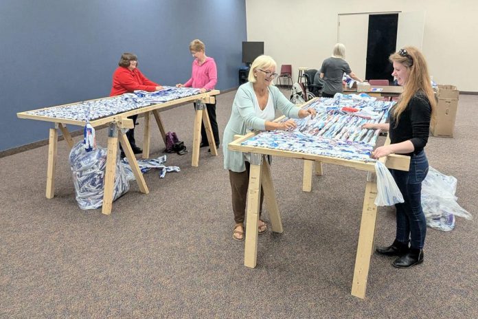 Meeting on a weekly basis at Calvary Pentecostal Church in Peterborough, volunteer community members have used a streamlined process to turn thousands of milk bags into sleeping mats for the unhoused community in the city since 2023. Now, through a new partnership with volunteer group Clean Up Peterborough, organizations and businesses can sponsor the build of additional looms to be used to produce even more sleeping mats. (Photo: Steve Paul / LinkedIn)