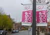 Light post banners on Hunter Street East in Peterborough's East City installed by the volunteer-led East City Village Business Improvement Area, which is merging with the Peterborough Downtown Business Improvement Area as part of a one-year pilot agreement. (Photo: Bruce Head / kawarthaNOW)