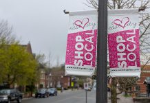Light post banners on Hunter Street East in Peterborough's East City installed by the volunteer-led East City Village Business Improvement Area, which is merging with the Peterborough Downtown Business Improvement Area as part of a one-year pilot agreement. (Photo: Bruce Head / kawarthaNOW)