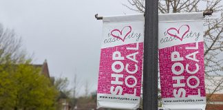 Light post banners on Hunter Street East in Peterborough's East City installed by the volunteer-led East City Village Business Improvement Area, which is merging with the Peterborough Downtown Business Improvement Area as part of a one-year pilot agreement. (Photo: Bruce Head / kawarthaNOW)