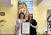 Five Counties Children's Centre clinical services director Darlene Callan and executive assistant Brandi Williamson-Meletiou display the three-year accreditation plaque from the Commission on Accreditation of Rehabilitation Facilities (CARF). In 1985, Five Counties was the very first children's treatment centre in Ontario to be accredited by the independent non-profit accreditor of health and human resources, and it has maintained its accreditation ever since. (Photo: Five Counties Children's Centre)