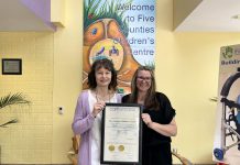 Five Counties Children's Centre clinical services director Darlene Callan and executive assistant Brandi Williamson-Meletiou display the three-year accreditation plaque from the Commission on Accreditation of Rehabilitation Facilities (CARF). In 1985, Five Counties was the very first children's treatment centre in Ontario to be accredited by the independent non-profit accreditor of health and human resources, and it has maintained its accreditation ever since. (Photo: Five Counties Children's Centre)