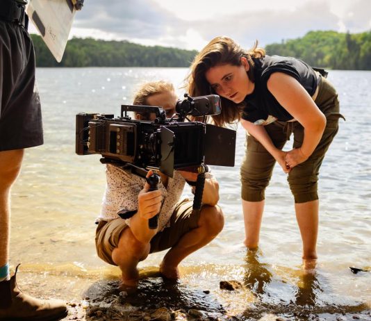 Toronto-based filmmaker Rebeccah Love consults with cinematographer Eric Rowe on a scene from her debut feature-length "Fortescue", which was shot at her family cottage on Fortescue Lake just east of Kinmount in the Haliburton Highlands. Love will be attending all four screenings of the film at Highlands Cinemas in Kinmount over the Victoria Day long weekend. (Photo: Eli Meadow Ramraj)