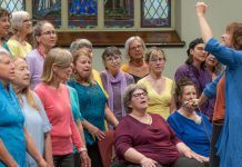 AbZolutely Choir Peterborough-Kawartha artistic director and founder Abby Zolz (right) leads the choir in a performance with purpose during their 2024 year-end concert, which was a fundraiser for One City Peterborough. The group has chosen GreenUP to benefit from their 2025 year-end concert happening Monday, May 26 at Murray Street Baptist Church in Peterborough. (Photo: Ian MacCready)