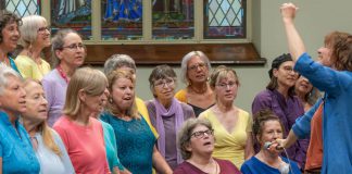 AbZolutely Choir Peterborough-Kawartha artistic director and founder Abby Zolz (right) leads the choir in a performance with purpose during their 2024 year-end concert, which was a fundraiser for One City Peterborough. The group has chosen GreenUP to benefit from their 2025 year-end concert happening Monday, May 26 at Murray Street Baptist Church in Peterborough. (Photo: Ian MacCready)