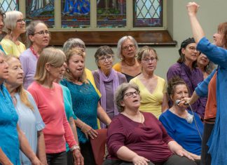 AbZolutely Choir Peterborough-Kawartha artistic director and founder Abby Zolz (right) leads the choir in a performance with purpose during their 2024 year-end concert, which was a fundraiser for One City Peterborough. The group has chosen GreenUP to benefit from their 2025 year-end concert happening Monday, May 26 at Murray Street Baptist Church in Peterborough. (Photo: Ian MacCready)