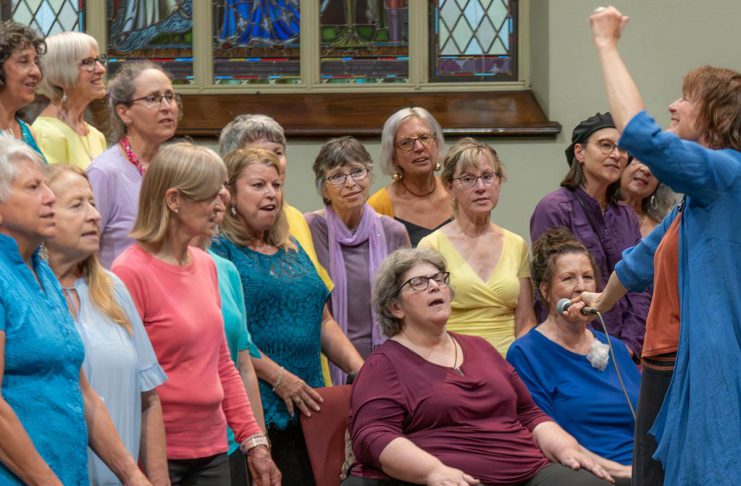 AbZolutely Choir Peterborough-Kawartha artistic director and founder Abby Zolz (right) leads the choir in a performance with purpose during their 2024 year-end concert, which was a fundraiser for One City Peterborough. The group has chosen GreenUP to benefit from their 2025 year-end concert happening Monday, May 26 at Murray Street Baptist Church in Peterborough. (Photo: Ian MacCready)