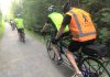Between the lone line of tandem bicycles and the bright colours, a TandemEyes group ride is hard to miss on a summer evening. Here, the group passes through Jackson Park in Peterborough on the way to the Orange Corners trestle bridge. (Photo courtesy of TandemEyes)