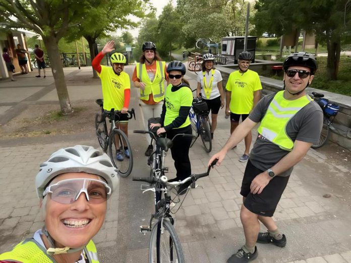 For people with vision loss, combining physical activity with social time on a group ride is integral to the mission of TandemEyes. Here a group relaxes post-ride at Millennium Park in Peterborough. (Photo: Darcy Wefers)