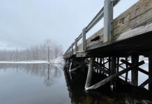 Located on Kirkfield Road across the narrows of Lake Dalrymple in Kawartha Lakes, Lake Dalrymple Bridge was built out of timber with a concrete deck circa 1970 and needs to be replaced due to continued deterioration of wood, concrete, and asphalt as well as erosion. (Photo: Tatham Engineering)