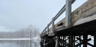 Located on Kirkfield Road across the narrows of Lake Dalrymple in Kawartha Lakes, Lake Dalrymple Bridge was built out of timber with a concrete deck circa 1970 and needs to be replaced due to continued deterioration of wood, concrete, and asphalt as well as erosion. (Photo: Tatham Engineering)