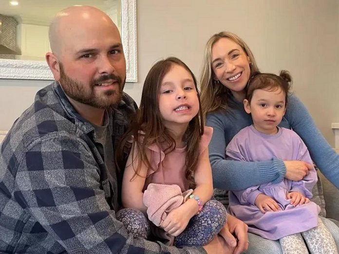 Her Yes Club founder Carmen Doucette with her husband and their two young girls. A full-time working mom, Doucette created Her Yes Club after experiencing first-hand the stress and frustration that mothers face every day when it comes to finding reliable childcare. (Photo via Her Yes Club website)