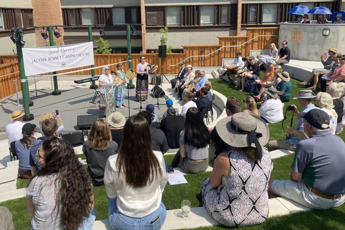 Around 100 people attended the grand opening celebration of the Jalynn Bennett Amphitheatre at Trent University's Catharine Parr Traill College on May 31, 2023, which featured several musical performances including the drum and vocal group Unity. The three-season outdoor performance venue was named in honour of the late businesswoman and trailblazer who wanted to fill a need for a centrally located, outdoor stage in the community. (Photo: Sebastian Johnston-Lindsay / kawarthaNOW)