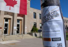 One of Our Future Peterborough's flyers taped to a light pole in front of Peterborough City Hall. Fighting against the restructuring and job elimination at the Peterborough Public Library is the "spark" that encouraged three Peterborough parents to form the grassroots organization committed to protecting the city's public services for children and families. (Photo courtesy of Our Future Peterborough)