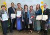 The winners of the second annual Peterborough Arts Awards in 2019 were Charlie Werger (Beth McMaster accepting on his behalf), Nimkii Osawamick, Beau Dixon and Patti Shaughnessy (Lisa Dixon accepting on Beau's behalf), Alice Williams, Hilary Wear, and Ryan Kerr. After a five-year hiatus due to the pandemic, the Electric City Culture Council (EC3) announced the return of the awards in November 2024, with the winners celebrated at a reception on June 12, 2025 at the Canadian Canoe Museum. (Photo: Bianca Nucaro-Viteri for kawarthaNOW)