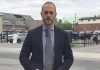 Detective sergeant Josh McGrath at the scene of a physical altercation on May 18, 2025 in downtown Peterborough that led to the death of a 41-year-old Peterborough man. Three of the four men arrested in the incident have been charged with manslaughter. (kawarthaNOW screenshot of Peterborough Police Service video)