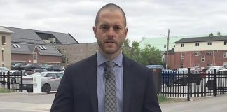 Detective sergeant Josh McGrath at the scene of a physical altercation on May 18, 2025 in downtown Peterborough that led to the death of a 41-year-old Peterborough man. Three of the four men arrested in the incident have been charged with manslaughter. (kawarthaNOW screenshot of Peterborough Police Service video)
