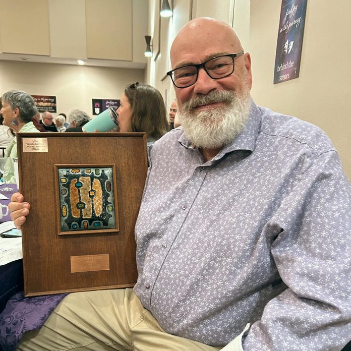 David Geene at the Eastern Ontario Drama League (EODL) Full-Length Festival awards brunch at The StoneHouse Hall in Peterborough on April 27, 2025 holding the EODL's set design award for the Peterborough Theatre Guild's production of "Silent Sky" by Lauren Gunderson, which ran from March 21 to April 5 at the Guild Hall in Peterborough's East City. (Photo courtesy of Peterborough Theatre Guild)